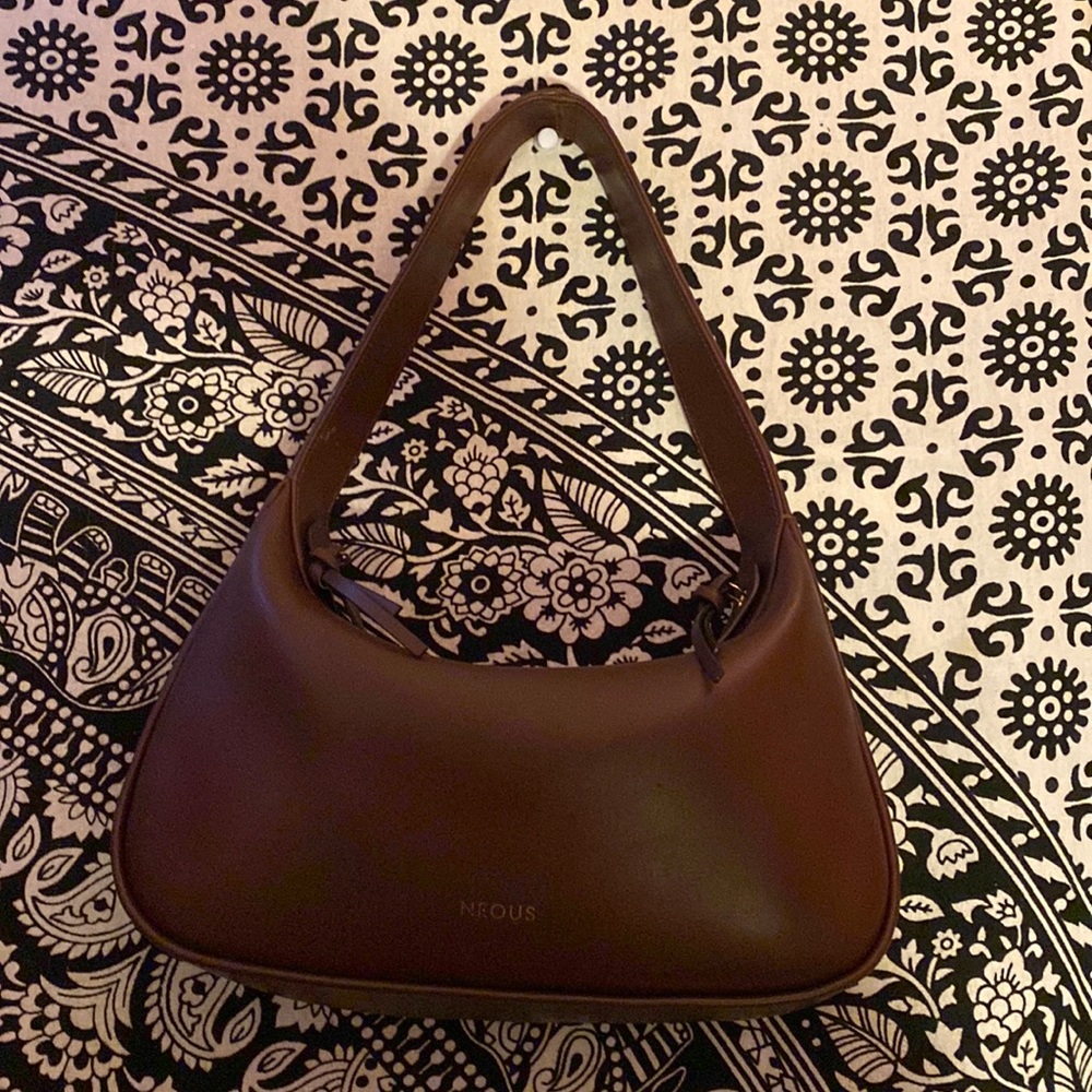 Dark brown luxury designer bag, Neous, now on sale due to student loan costs